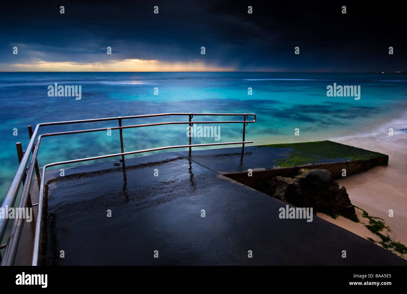Stormy skies at sunset over the wheelchair accessible fishing ramp at ...
