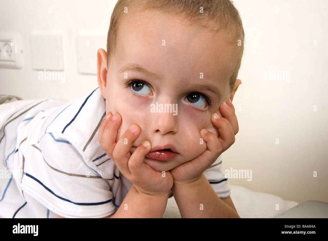 child in thinking pose Stock Photo - Alamy