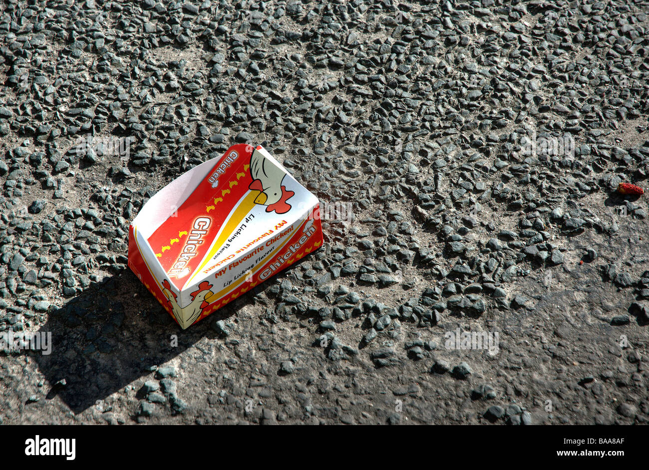 Flavourite Chicken box thrown out of a car onto a road Stock Photo