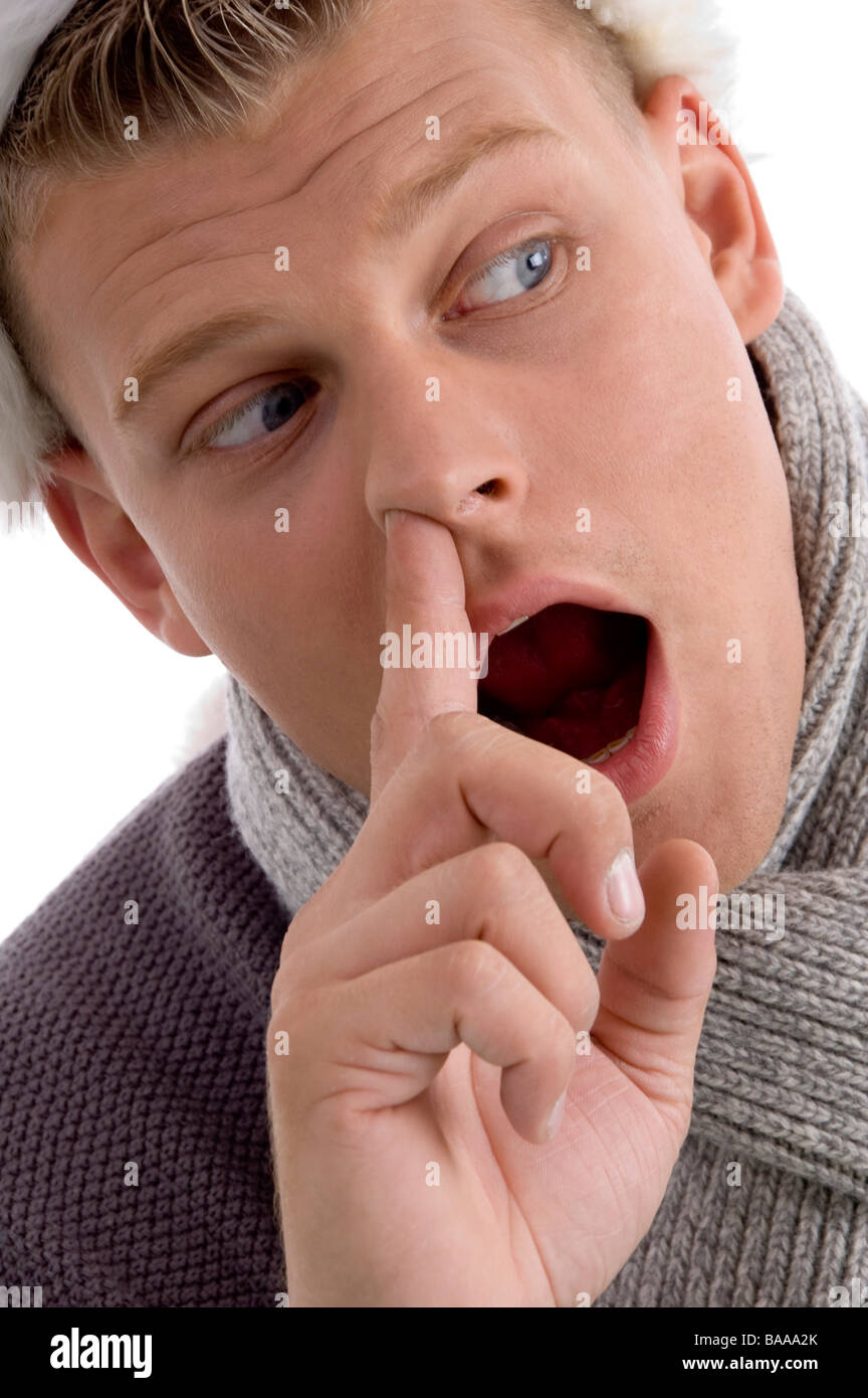 man with christmas hat putting finger in his nose Stock Photo - Alamy