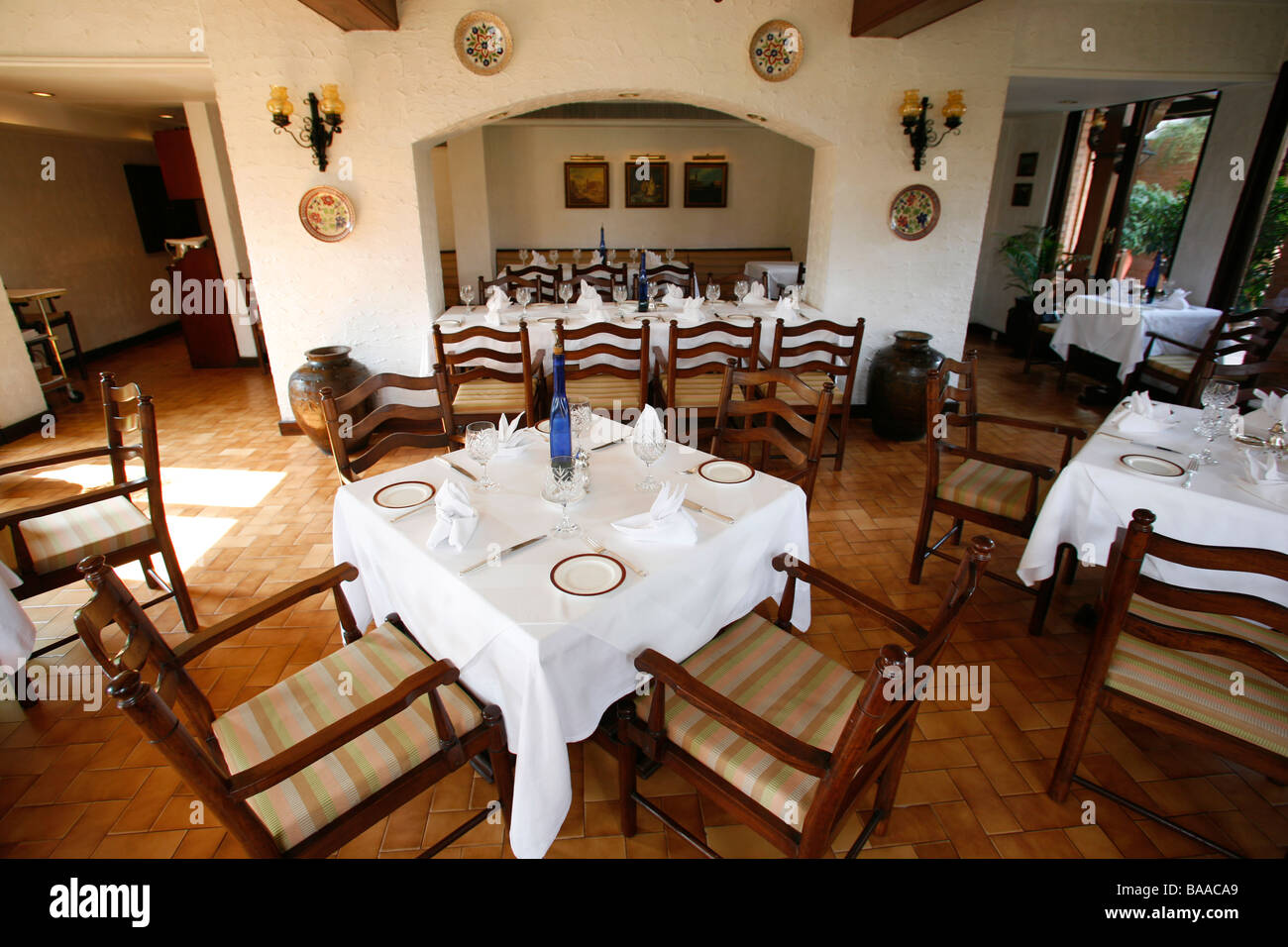 Interior of Italian restaurant with white table cloths Stock Photo