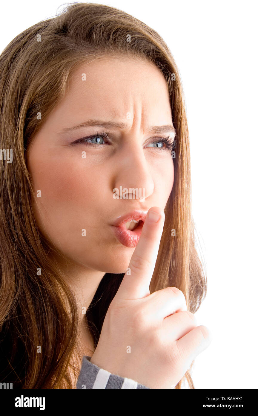 female showing keep shushing sign in anger Stock Photo