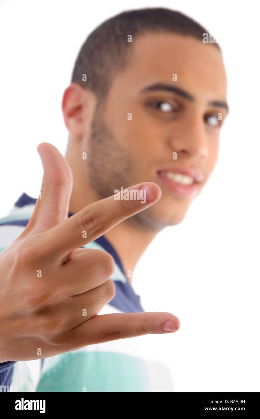 young guy showing rock hand gesture Stock Photo - Alamy