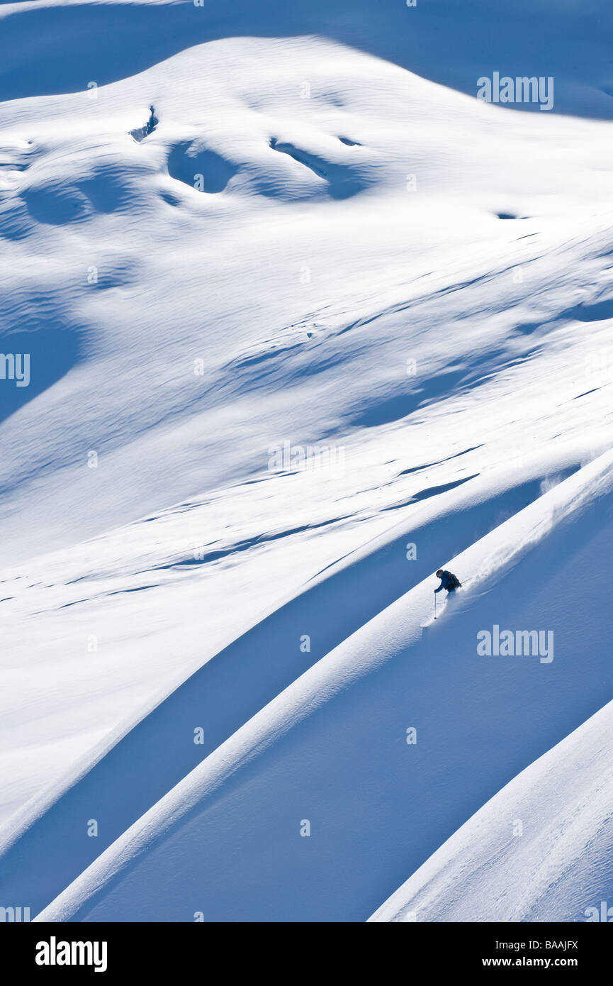 Woman big mountain skiing In the Chilkat Mountains near Haines, Alaska. Stock Photo