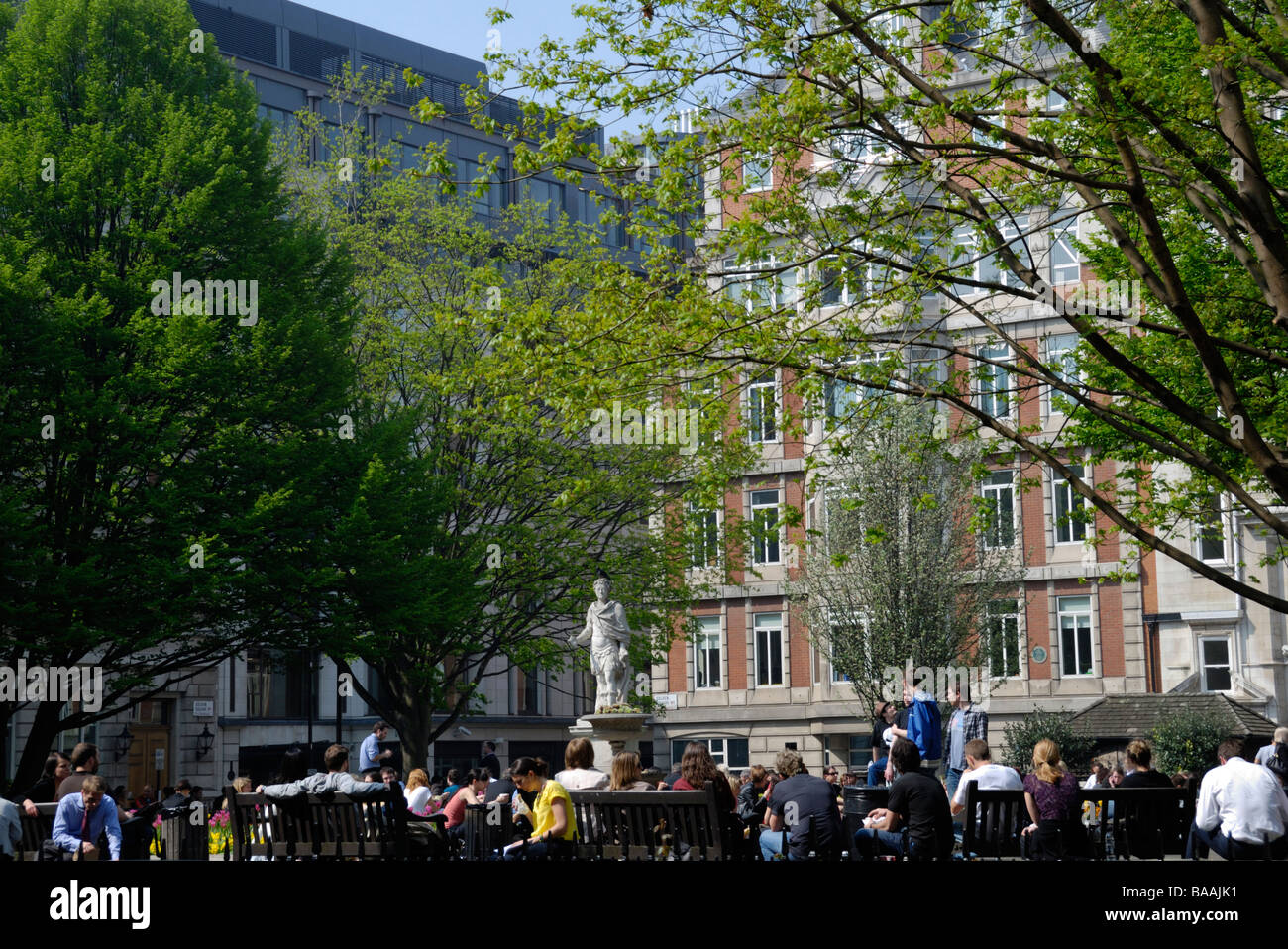 Lunchtime office workers in Golden Square Gardens Soho London Stock Photo