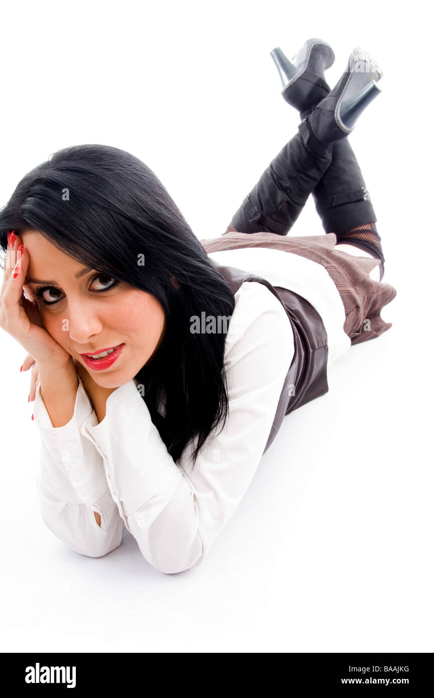 female model lying down on floor and looking at camera Stock Photo