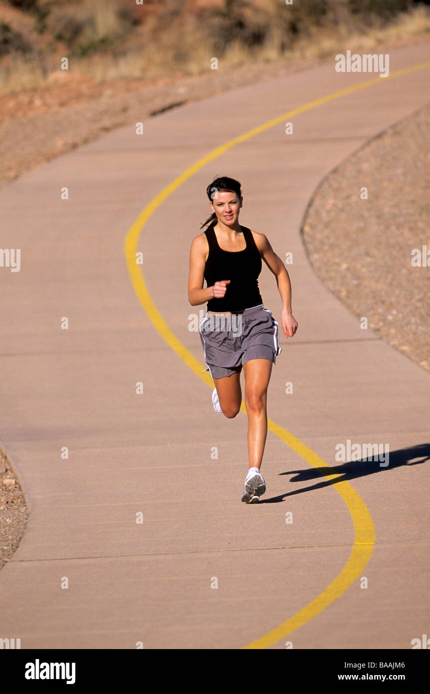 Woman running on paved trail in St. Utah Stock Photo Alamy