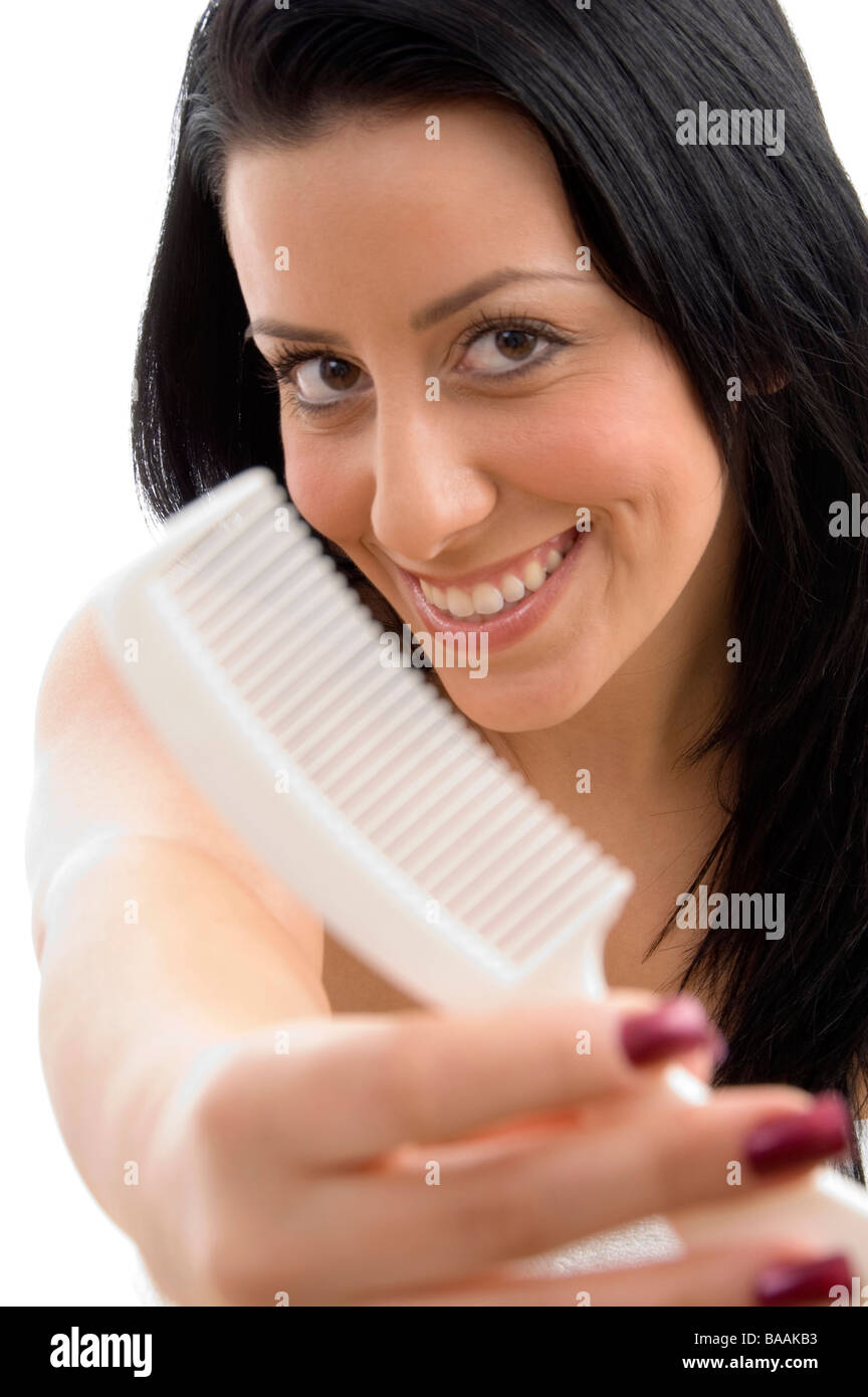 portrait of female showing comb Stock Photo - Alamy