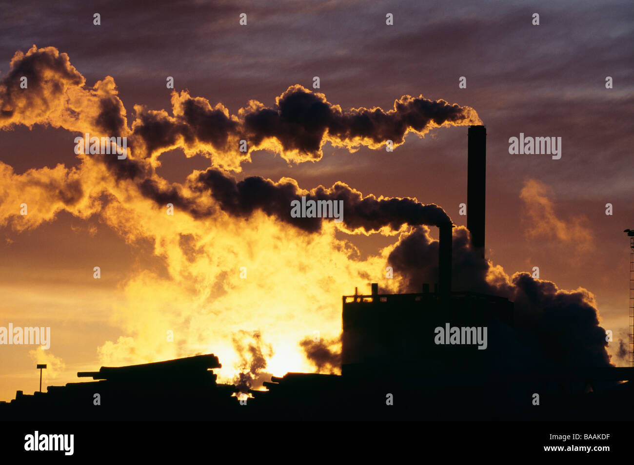 Smoke coming out of chimneys Stock Photo