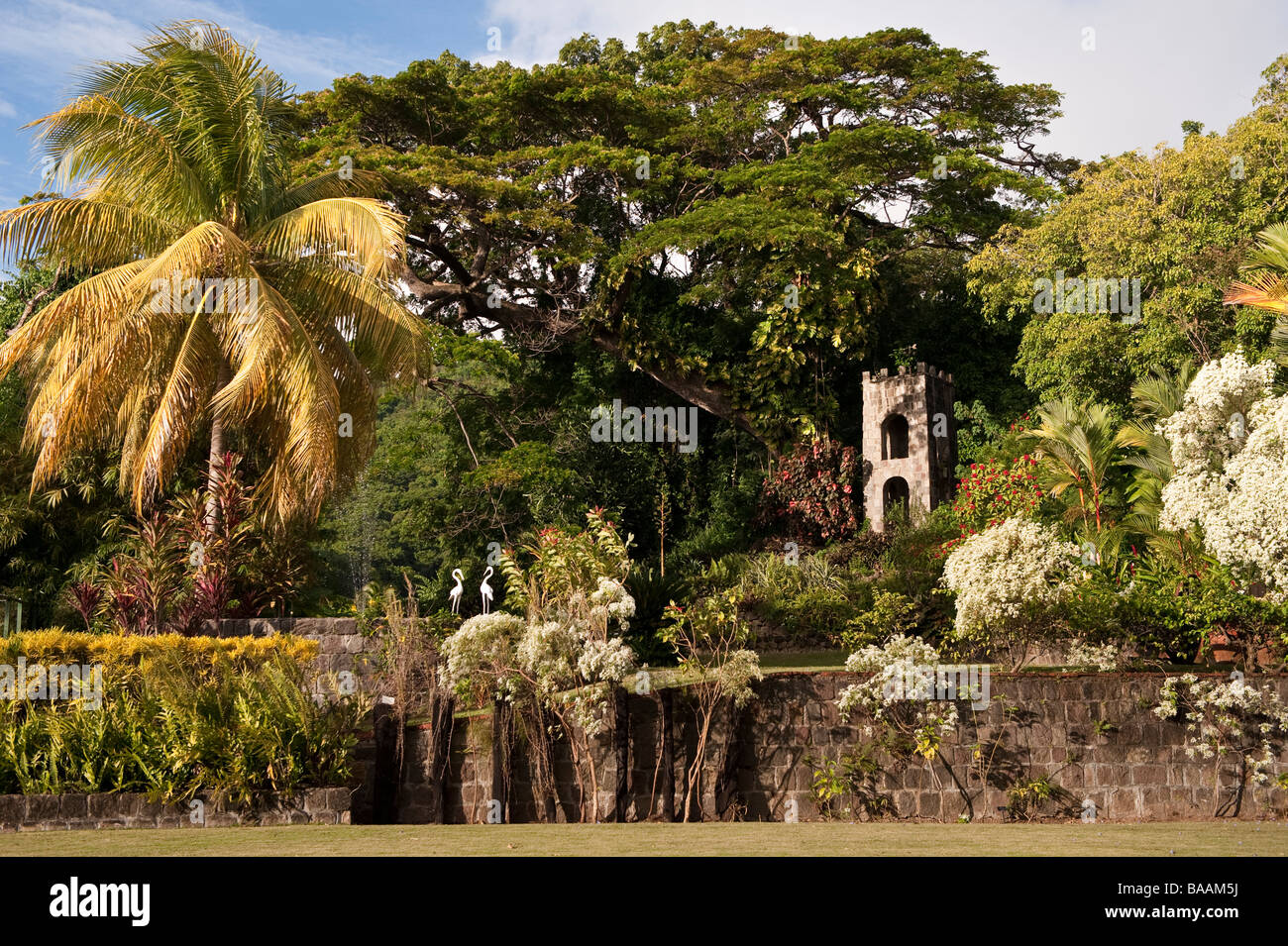Estate bell in the beautiful garden at Romney Manor on the Caribbean island of St Kitts Stock Photo