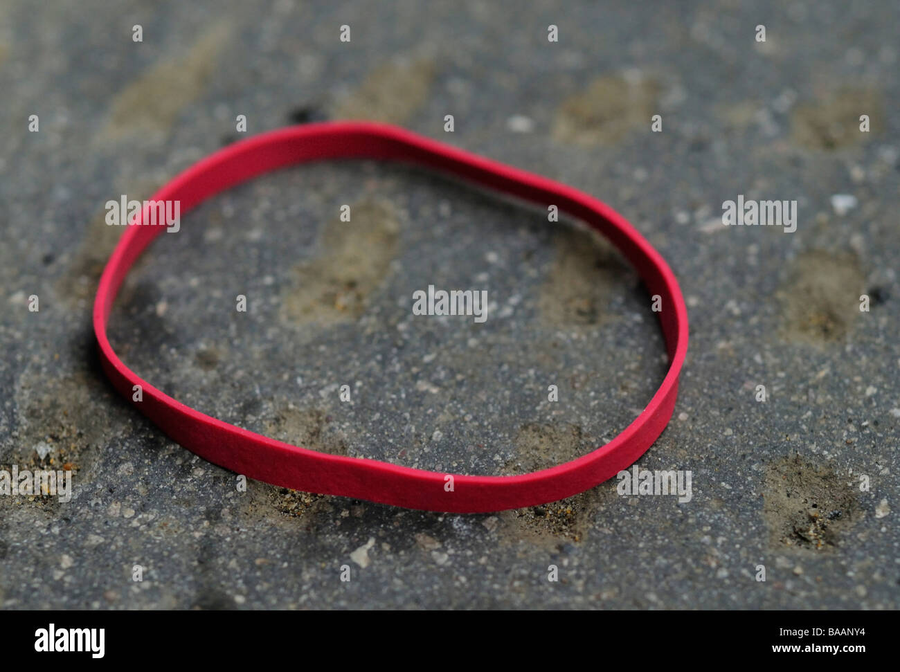 Discarded Red Post Office Elastic Bands Stock Photo Alamy