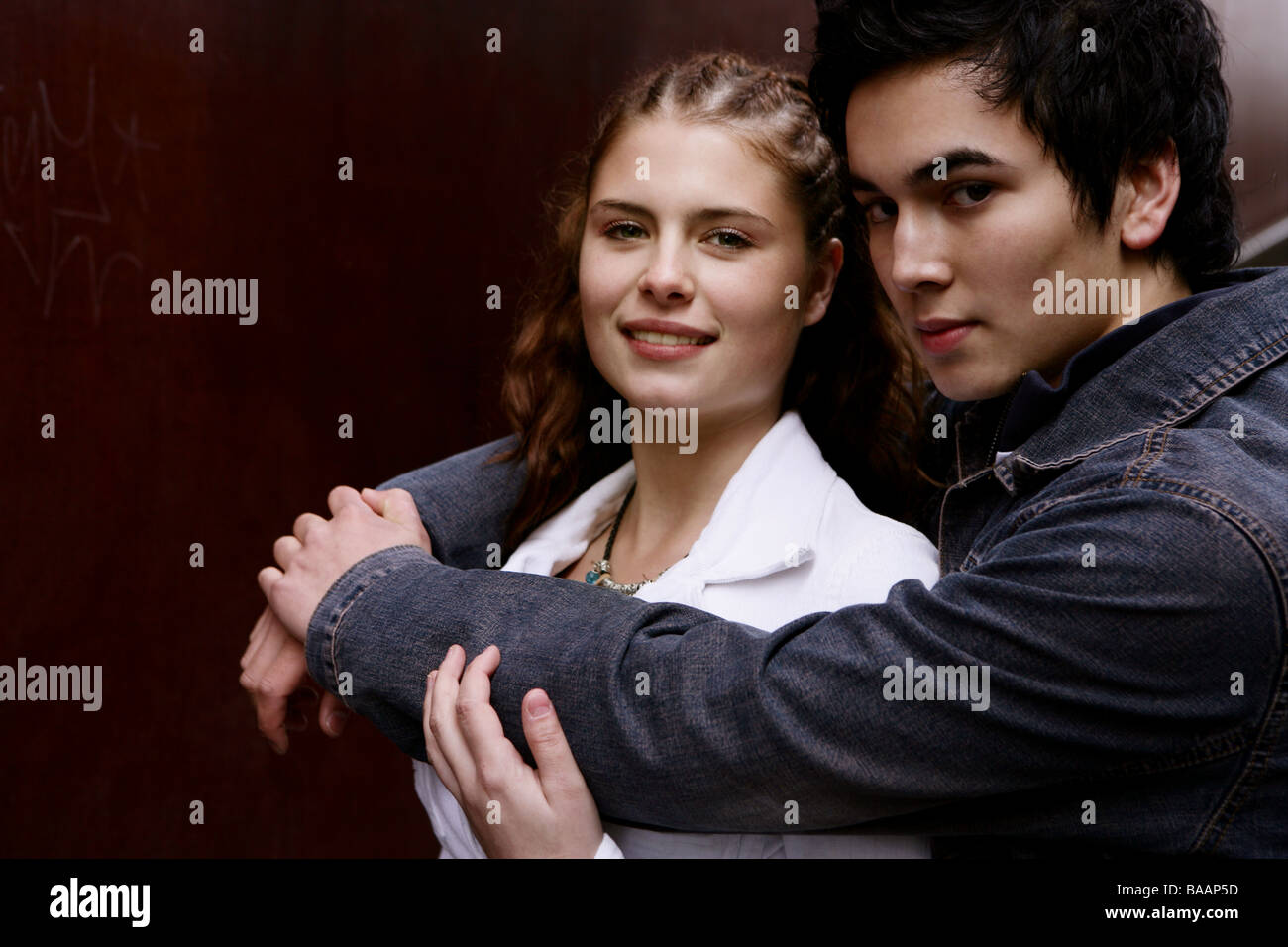 Portrait of teenager couple hugging Stock Photo