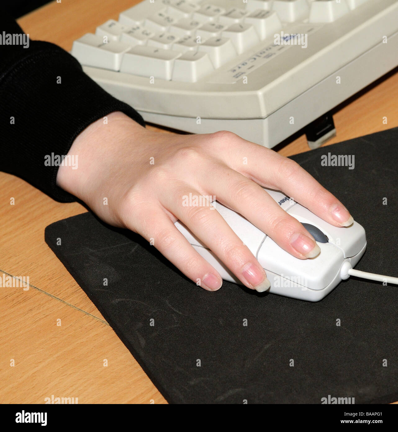 Female hand using a computer mouse Stock Photo - Alamy