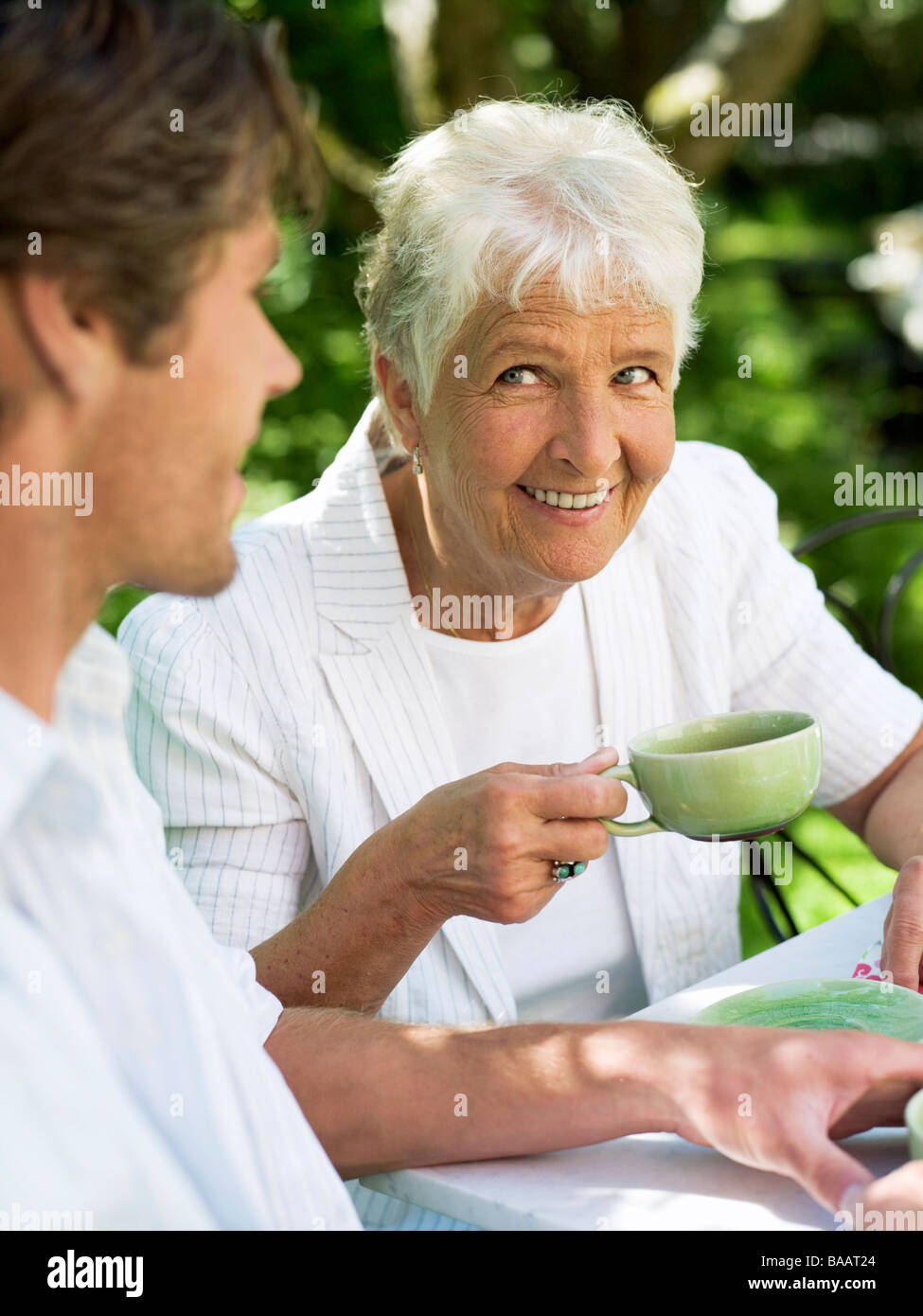 A man and a woman having a cup of coffee, Stockholm, Sweden Stock Photo
