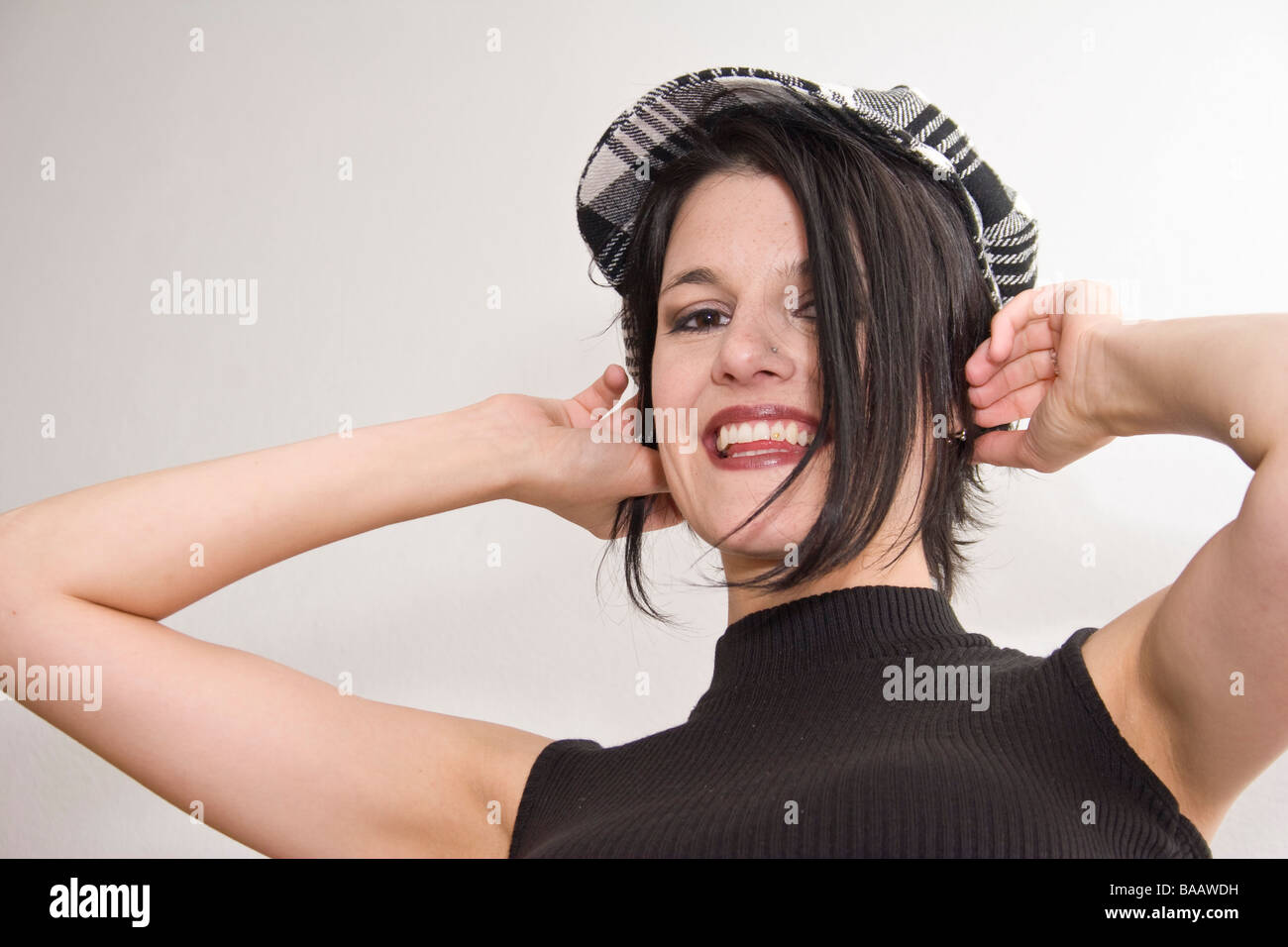 Young woman with plaid cap - Junge Frau mit karierter Mütze Stock Photo