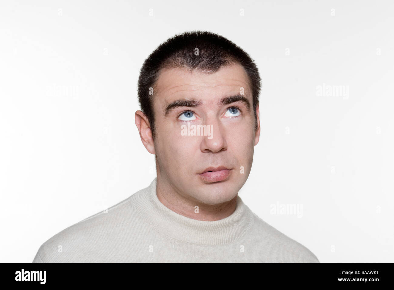 Portrait of an handsome expressive man in studio on white isolated background Stock Photo