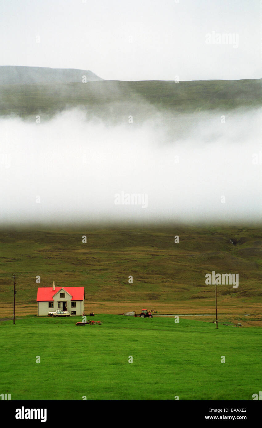 Arnes cattle-breeding farm with Maelifellshnjukur mountain in the background, Varmahlid, Iceland Stock Photo