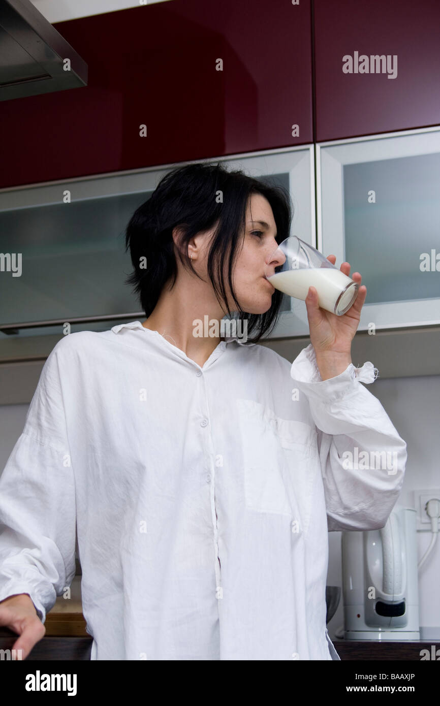 Young woman drinking milk - Junge Frau trinkt Milch Stock Photo