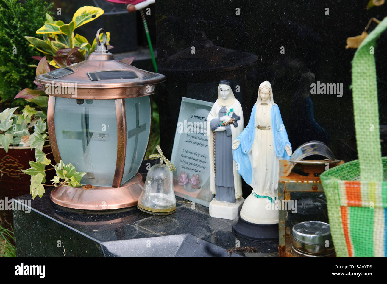 Catholic relics and statues on a grave Stock Photo