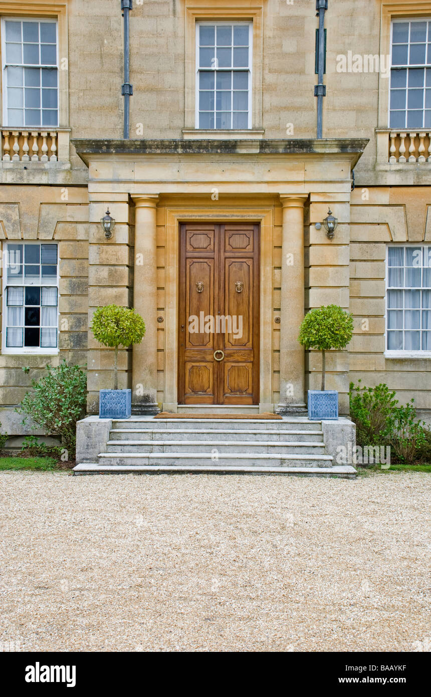 front door of stately home with bay trees Stock Photo Alamy