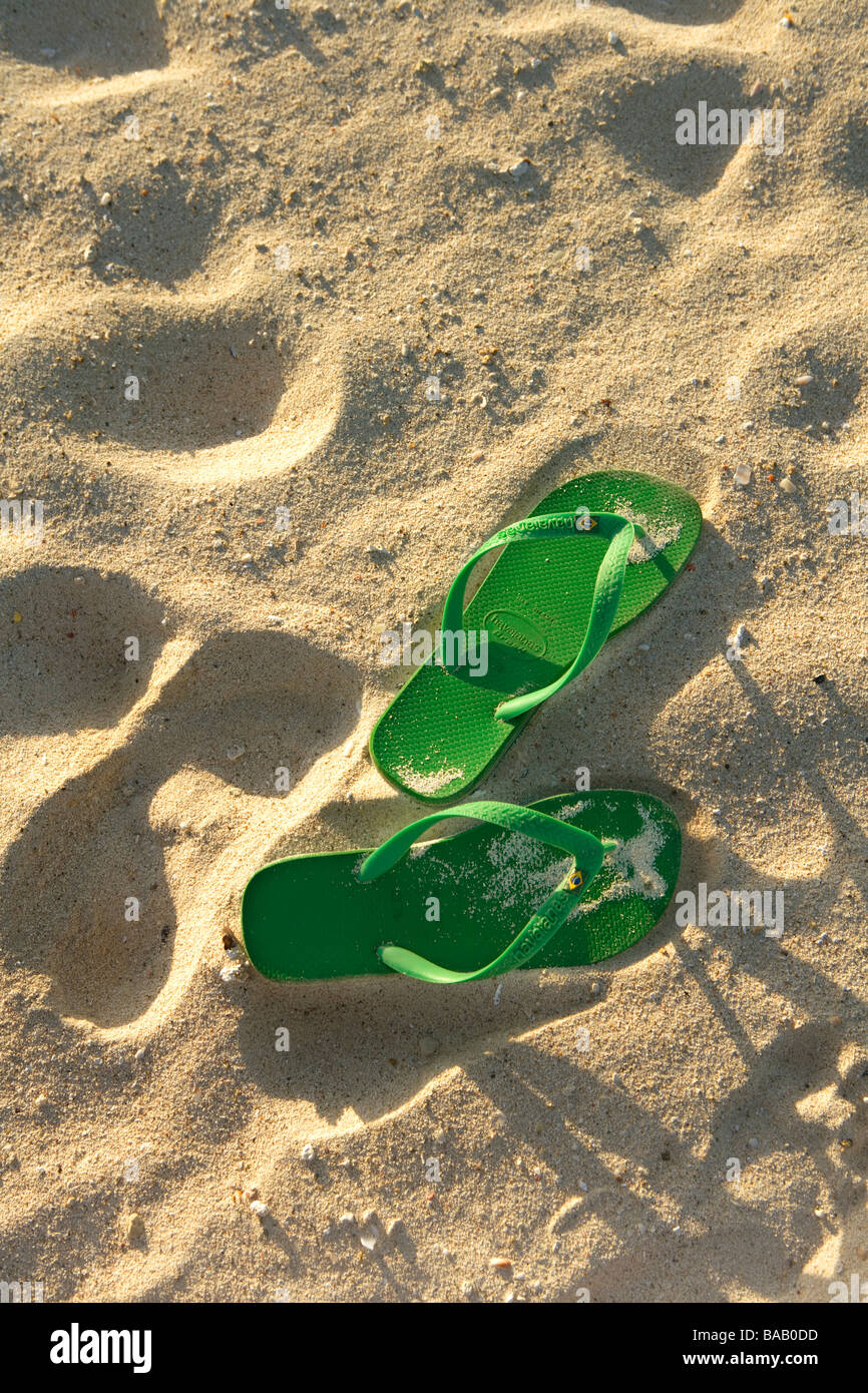 Green flip-flops on the beach, Aruba Stock Photo - Alamy