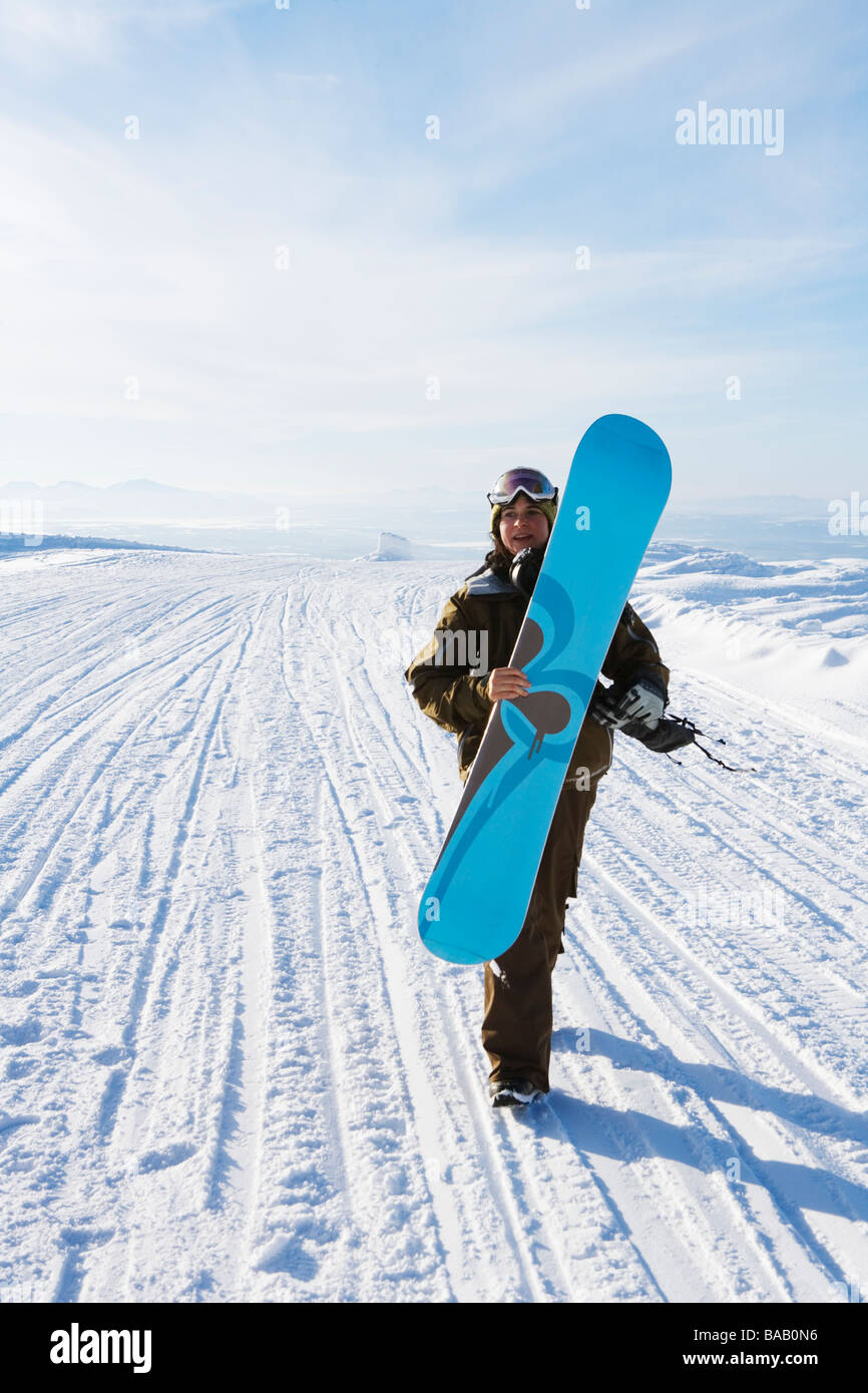 A woman with a snowboard, Sweden Stock Photo - Alamy