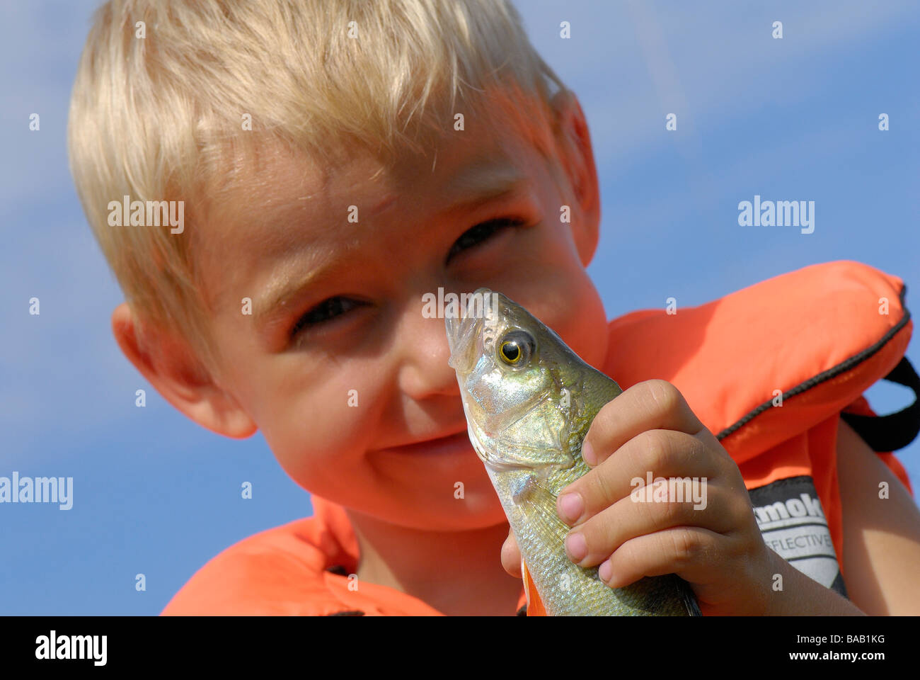 A boy with a perch Sweden Stock Photo