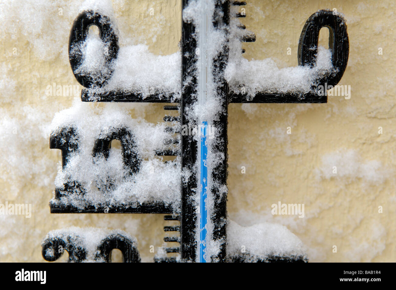 A thermometer covered with snow Sweden Stock Photo