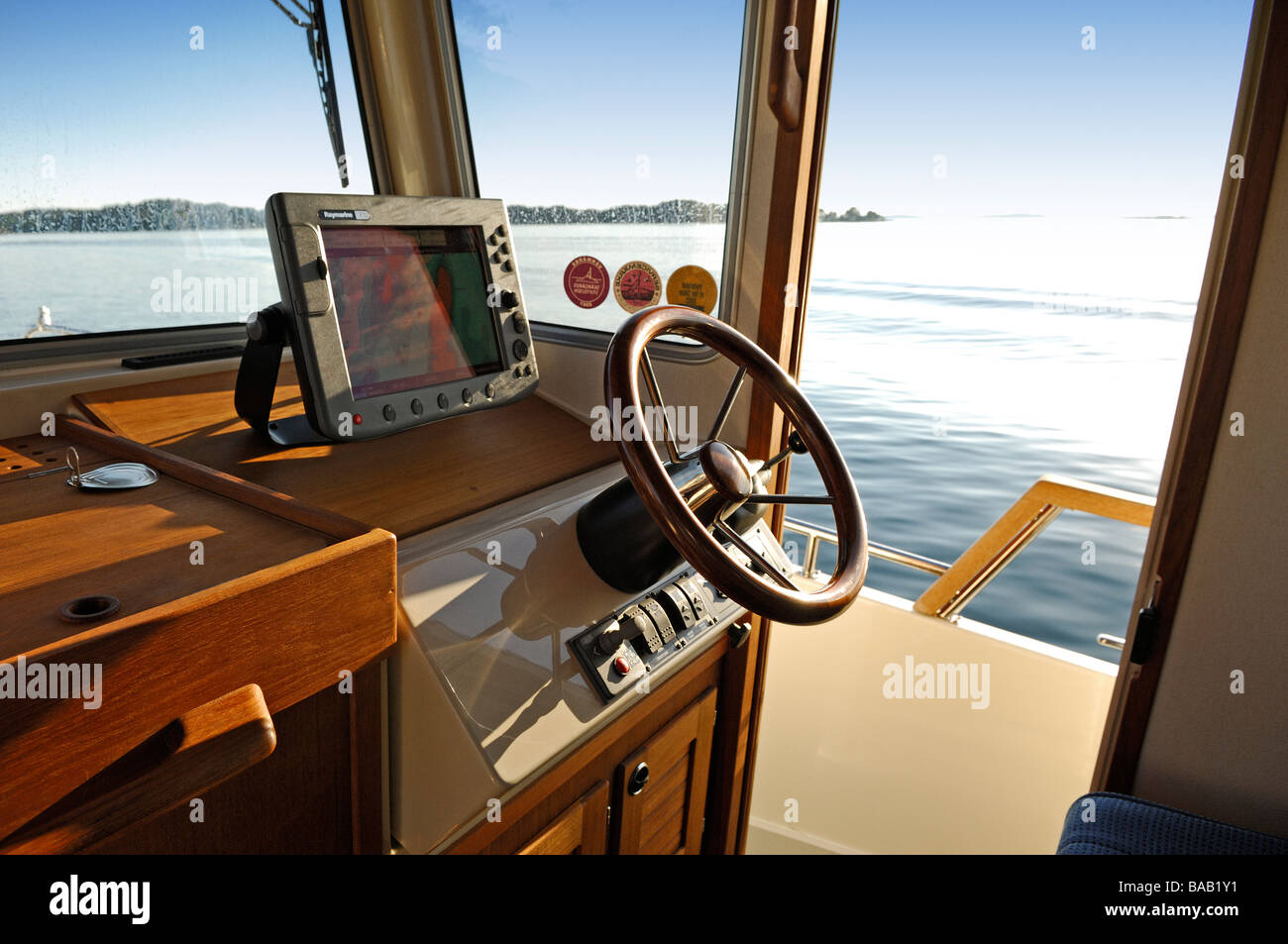 Driver seat on a boat hires stock photography and images Alamy