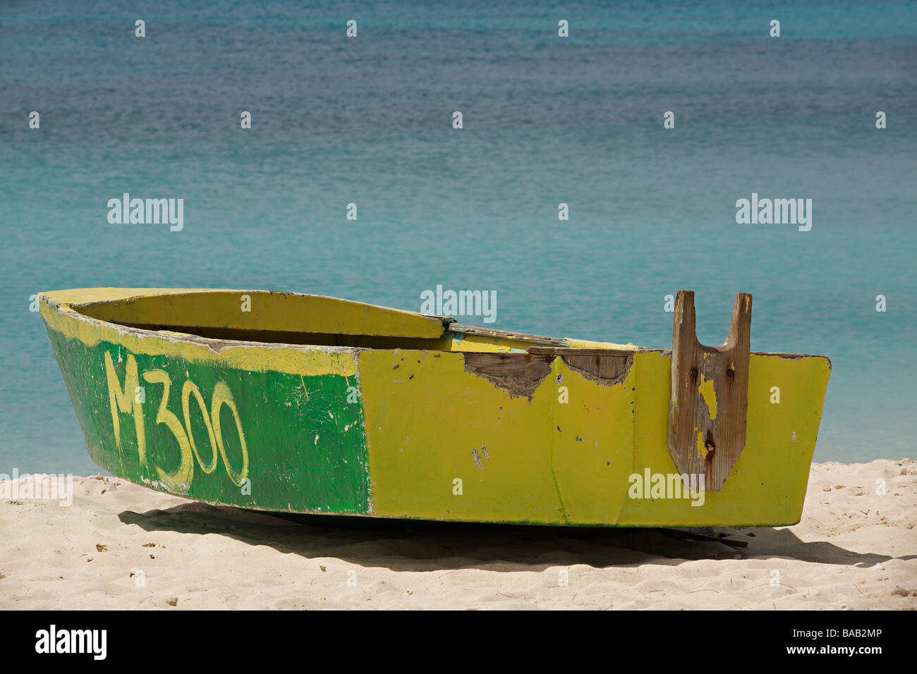 Traditional fishing boat on the West Coast of Barbados beach, "West