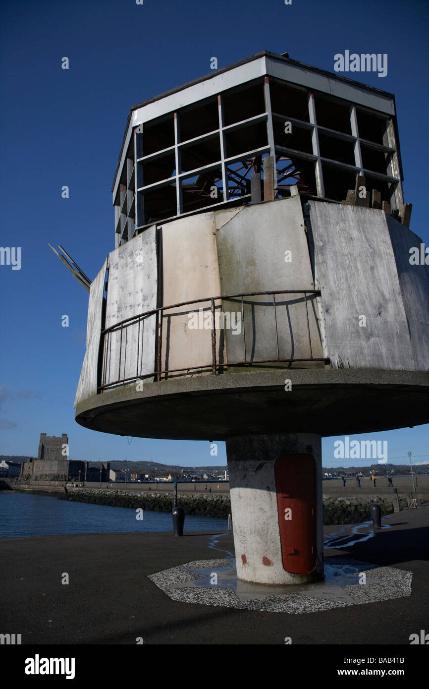 former radio control tower now derelict but with plans for restoration on the albert edward east pier in carrickfergus harbour Stock Photo