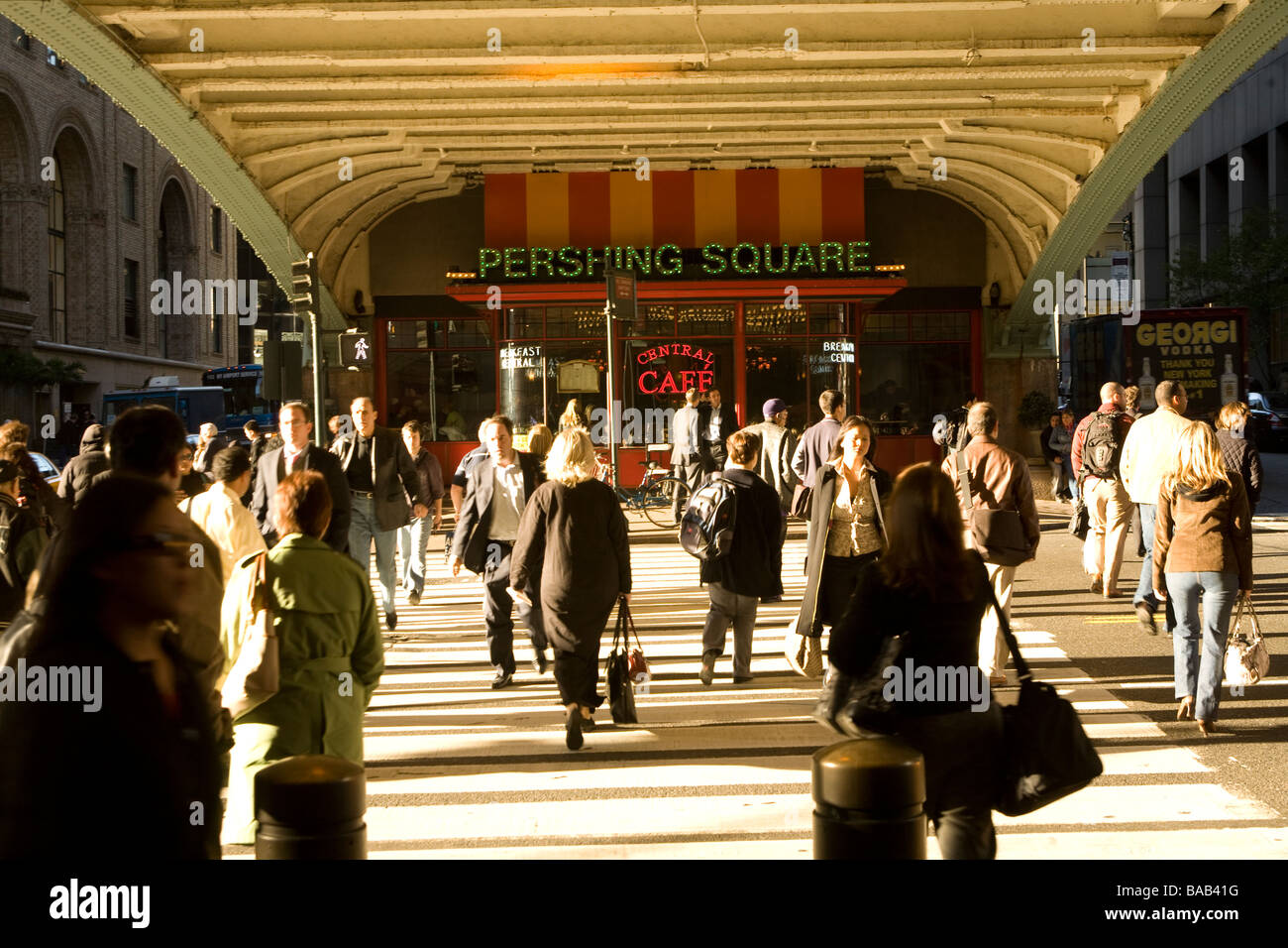 Exiting Grand Central Station and crossing 42nd Street under the Park Avenue overpass in Manhattan Stock Photo