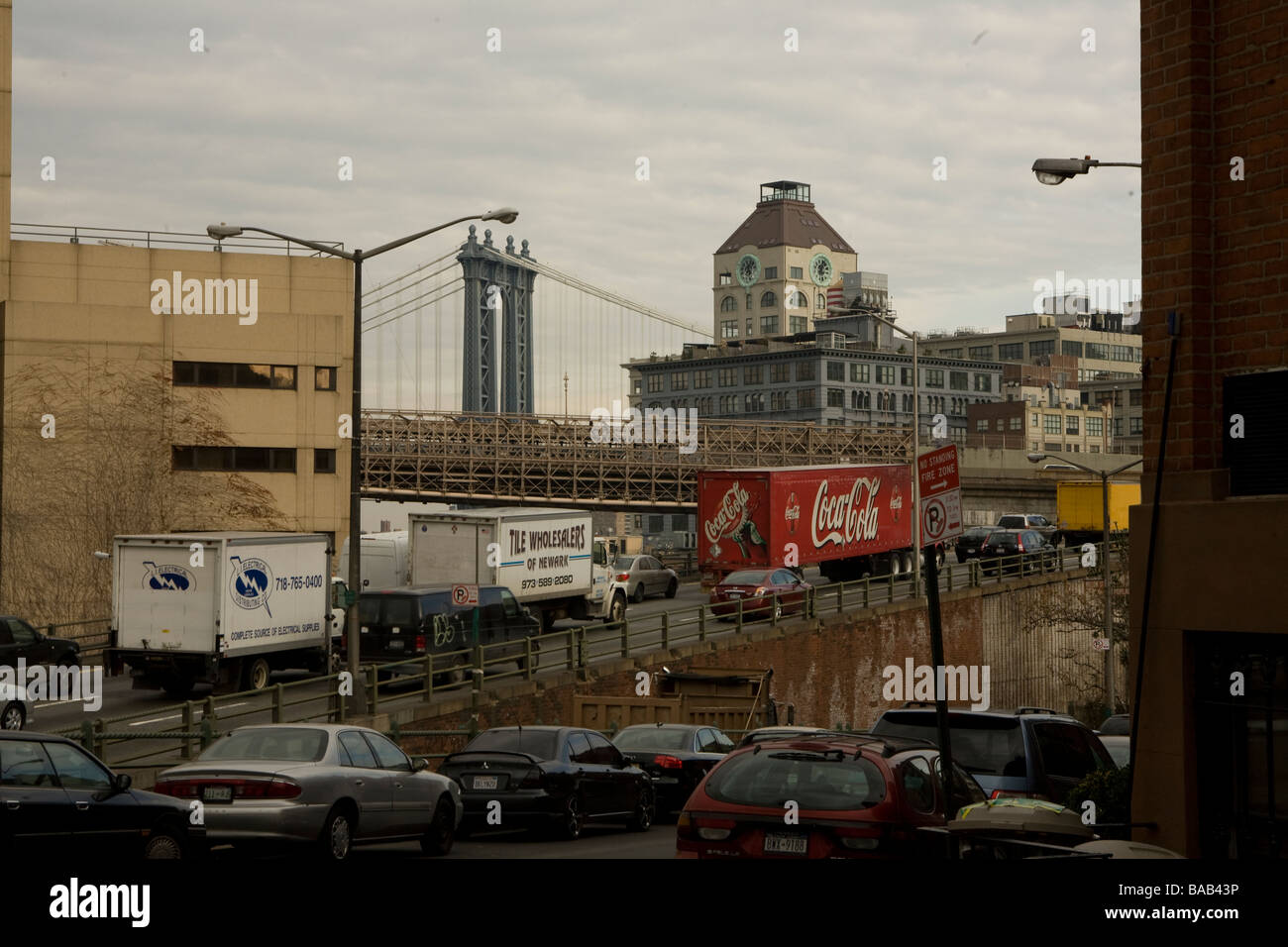 Traffic on the BQE expressway in Brooklyn with a tower from the