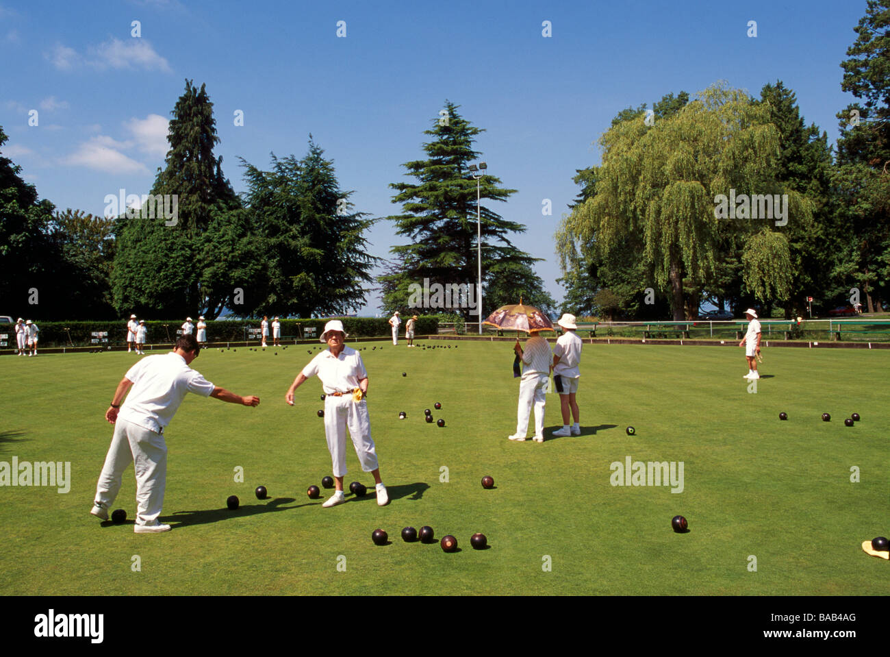 Seniors Lawn Bowling outdoors on Green Grass in Stanley Park in Summer Vancouver British Columbia Canada Stock Photo