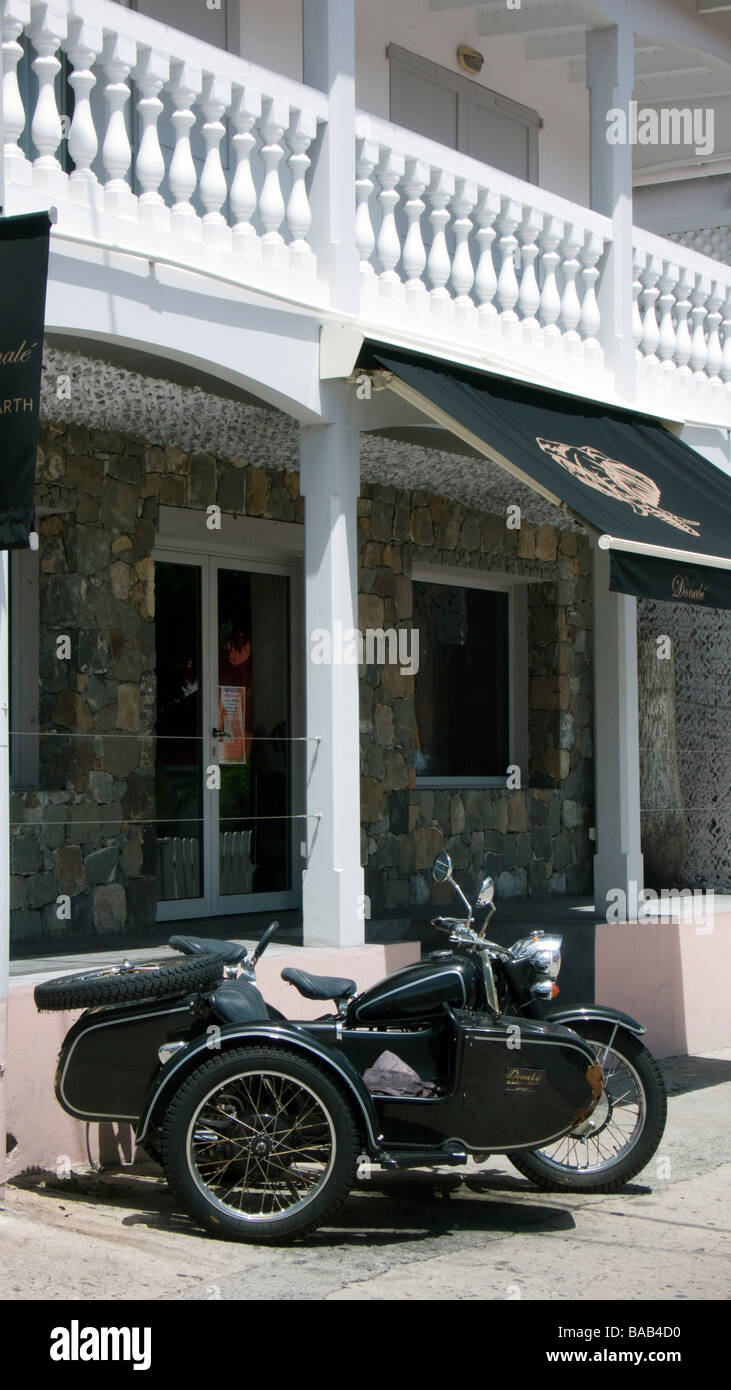 Vintage motorcycle and sidecar outside Donale boutique Gustavia St Barts Stock Photo