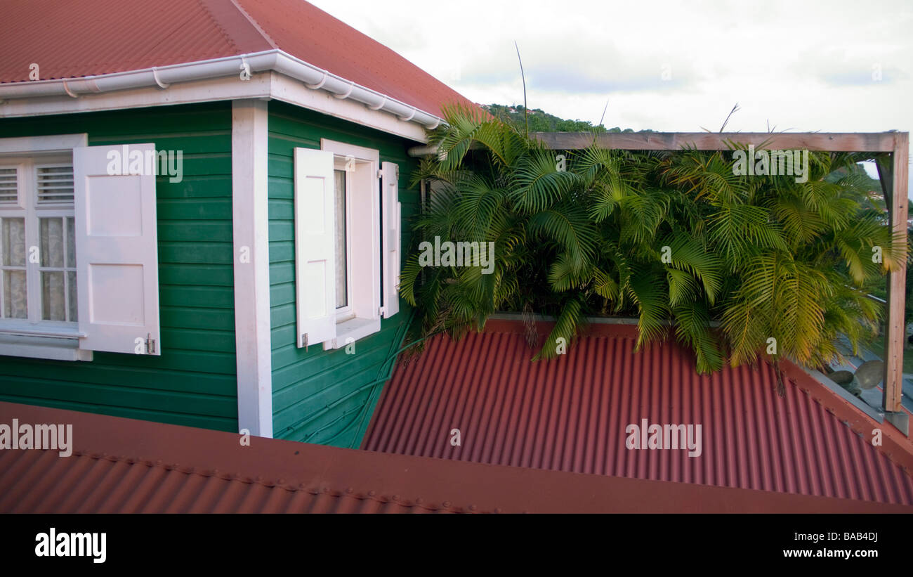 Traditional red tin roof and wooden clapboard building Gustvia St Barts Stock Photo