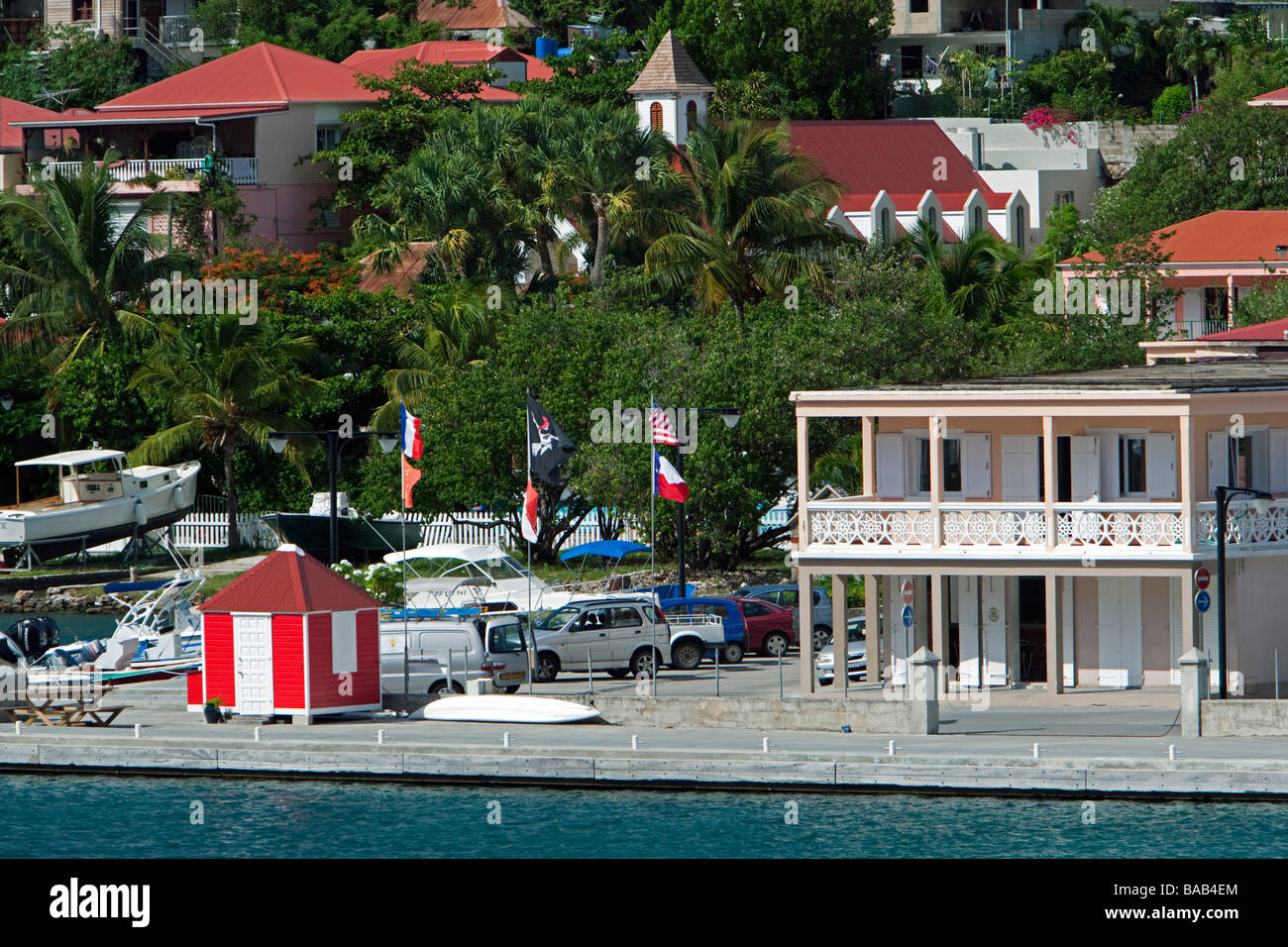Red tin roof buildings and palms Gustavia port St Barts Stock Photo