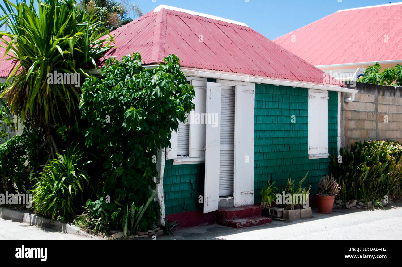 Tiny traditional wood shingle and shutter red tin roof house Gustavia St Barts Stock Photo