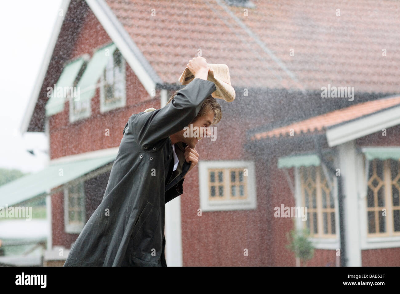 A man outdoors in the rain, Sweden Stock Photo Alamy