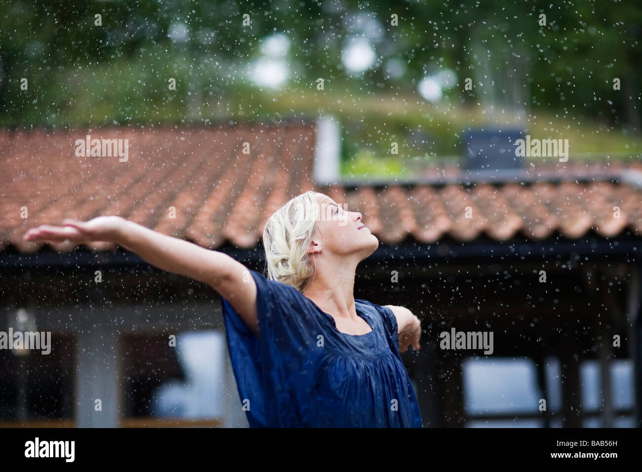 A woman enjoying the rain, Sweden Stock Photo Alamy