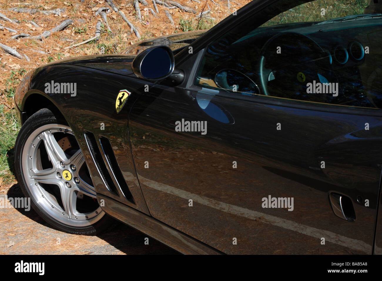 Black Porsche car with the wheel rim and logo pictures images photos photograph large high resolution horizontal in USA US hi-res Stock Photo