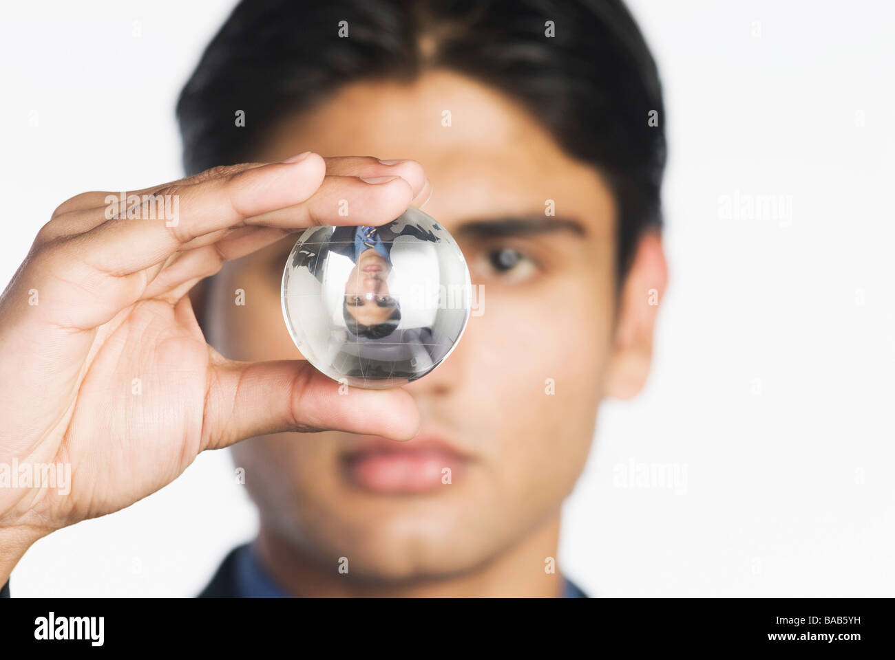 Businessman looking into crystal ball hi-res stock photography and ...