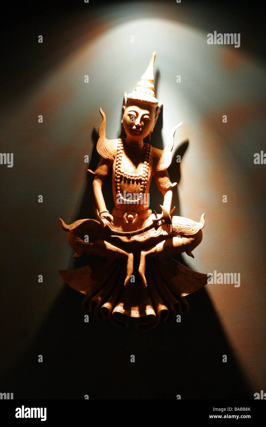 Wood carving of a Thai God Stock Photo Alamy