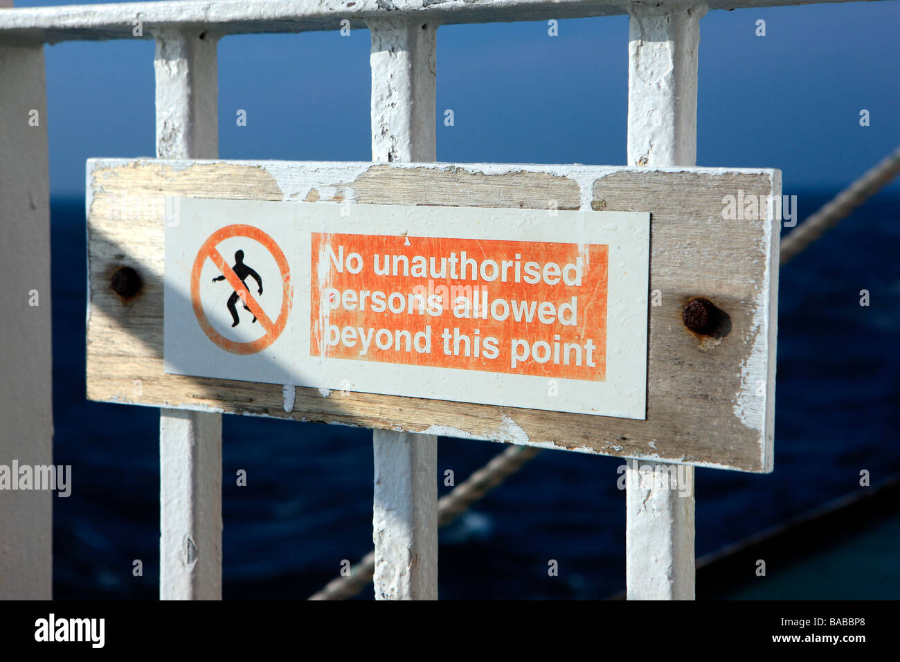 No unauthorised person allowed beyond this point sign Stock Photo