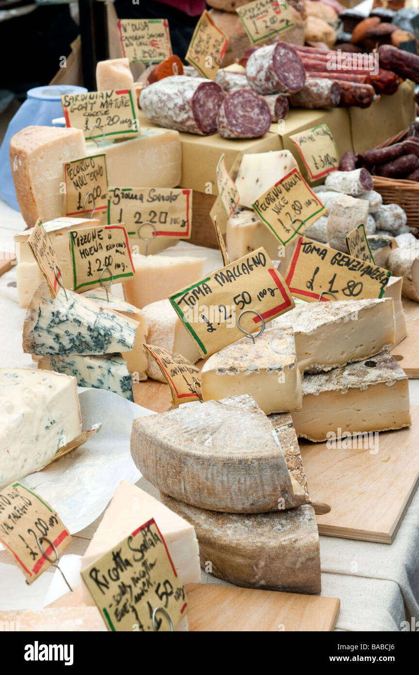 Continental cheeses on market stall in Broadway Market, London, England