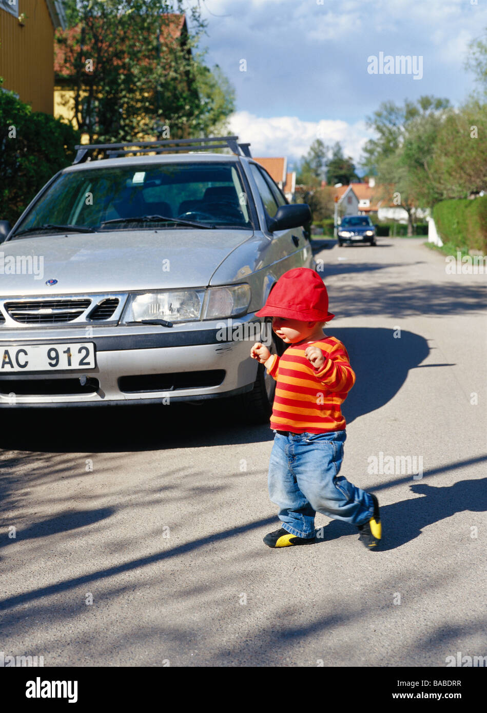 Child Running Across The Street Sweden Stock Photo Alamy