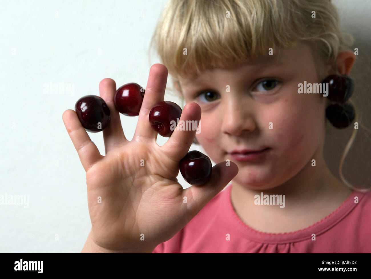 Girl with sweet cherries Stock Photo Alamy