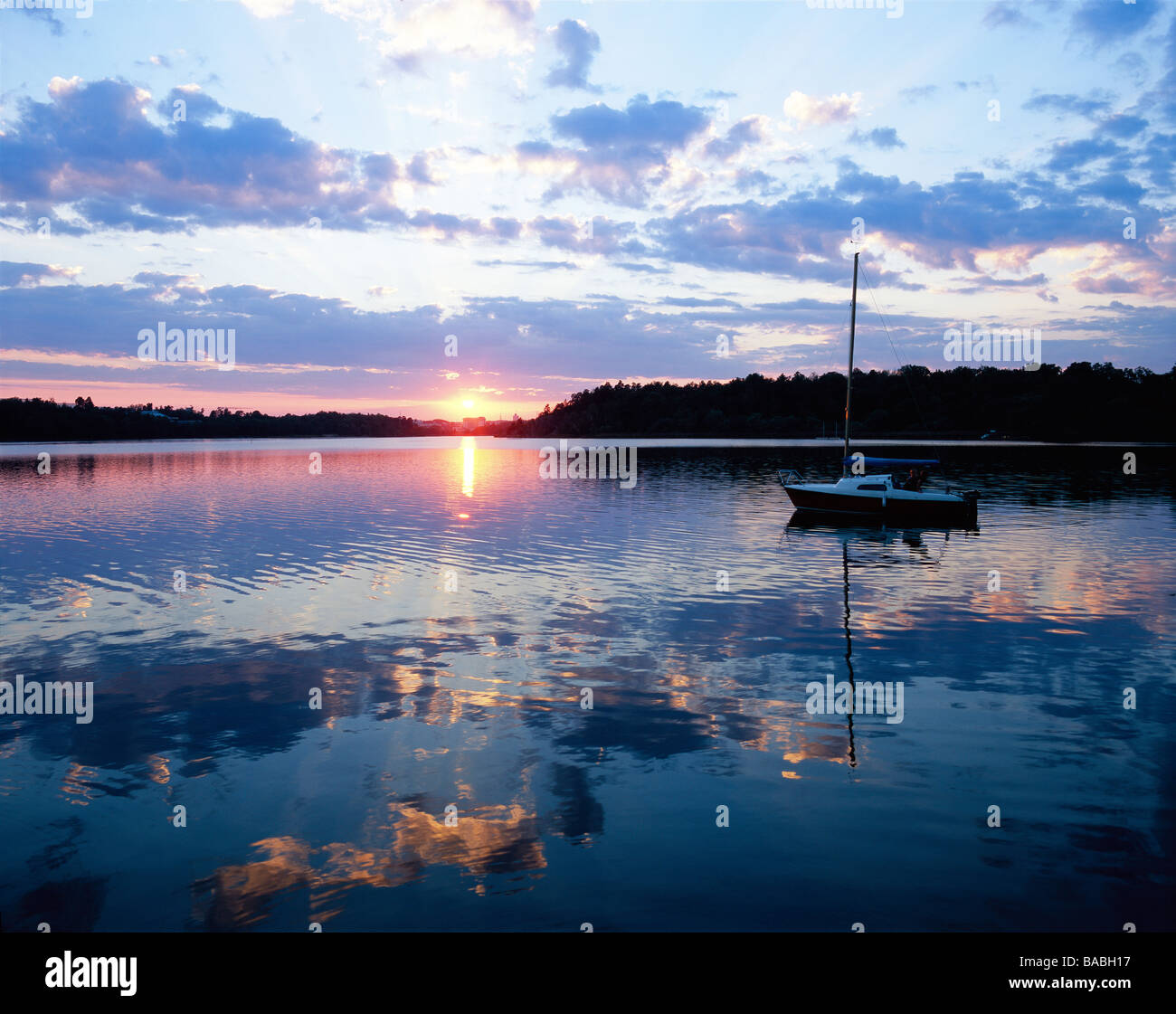 Sailing boat at sunset hi-res stock photography and images - Alamy
