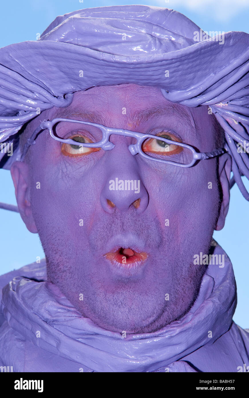 A man painted purple Stock Photo
