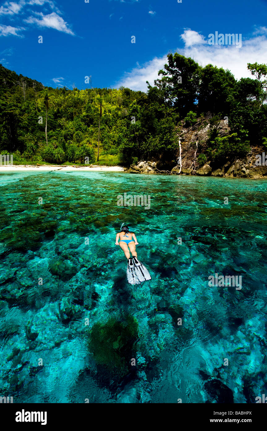 Snorkeling in Raja Empat, Papua, Indonesia, female diver, bikini, clear
